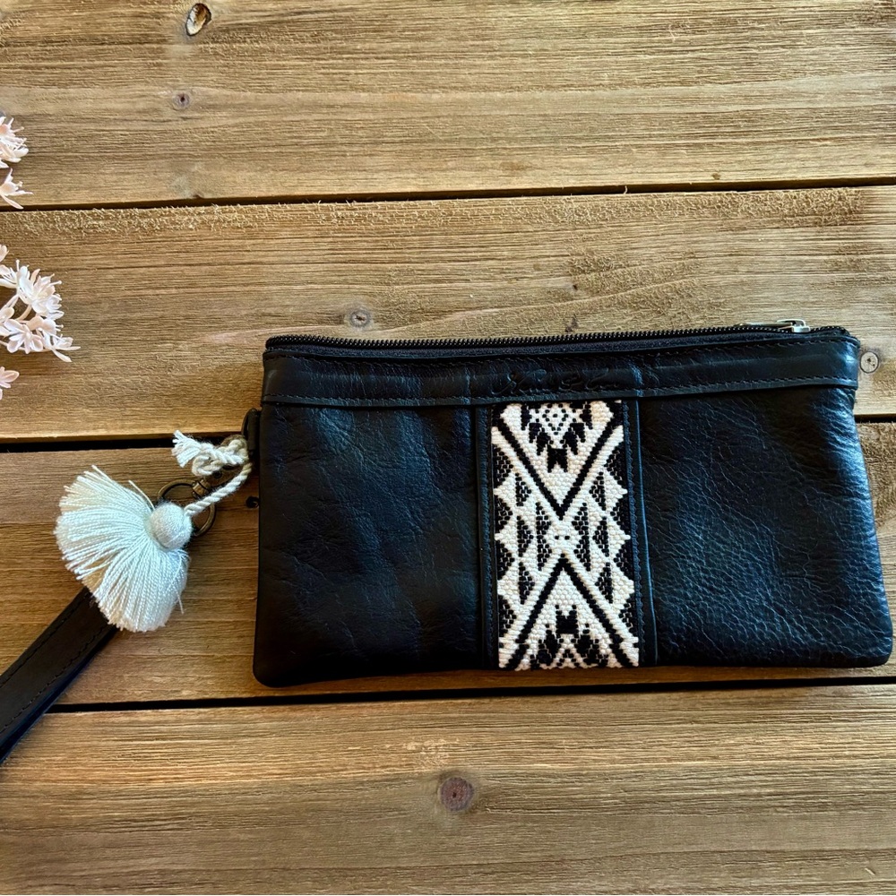 woven fabric and black leather wristlet clutch by Nena & Co.